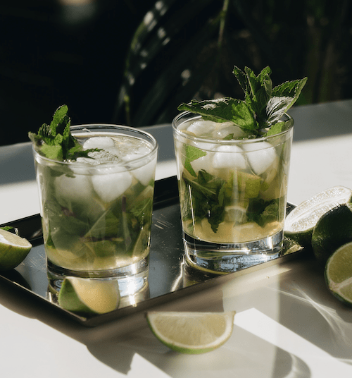 cocktail with mint leaves, CBD Tea, white rum and lime